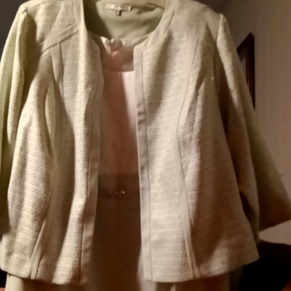 Mint two-piece dress with jacket wich is also mint .